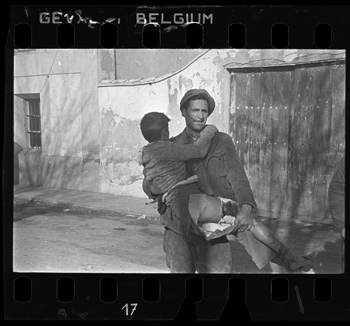 Robert Capa [Man carrying a wounded boy, Teruel, spain], late December 1937 Negative. Copyright International Center of Photography / Magnum Collection, International Center of Photography.